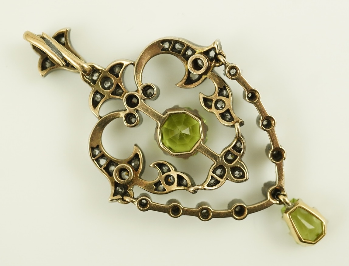 A Victorian gold and silver, peridot and diamond cluster set articulated drop pendant